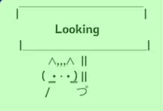 Cat holding sign that reads: Looking
